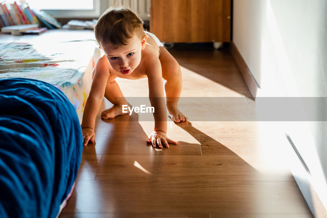 Close-up of baby playing at home