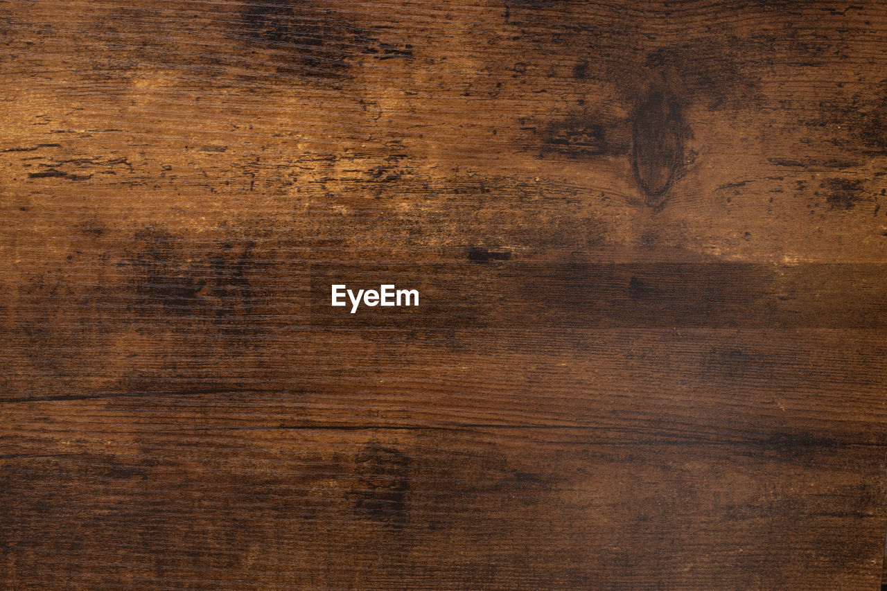 Close up details of vintage aged dark wood board texture background