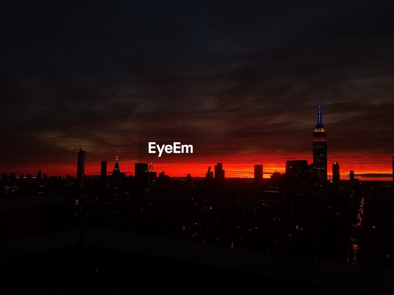 Silhouette of city at sunset