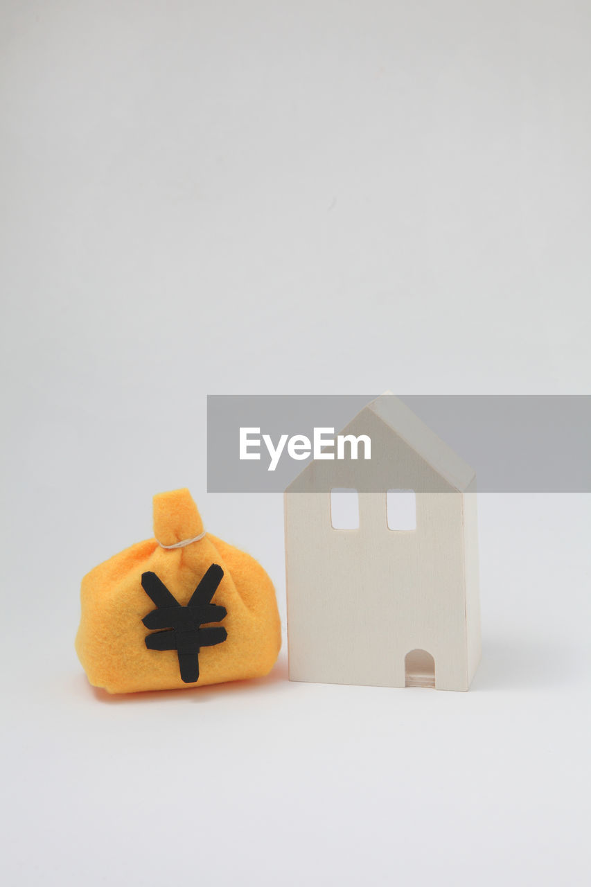 CLOSE-UP OF STUFFED TOY ON WHITE BACKGROUND