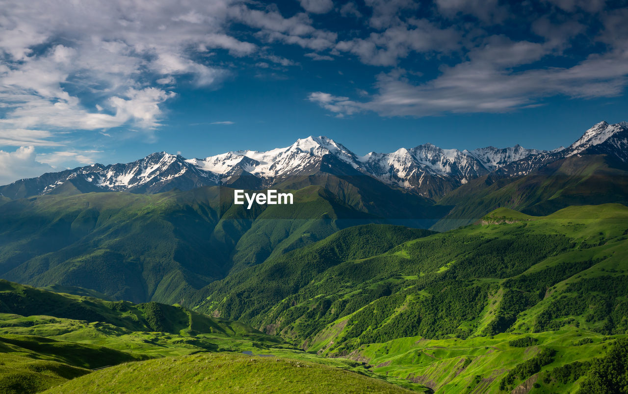 Scenic view of snowcapped mountains against sky. mountains of chechnya