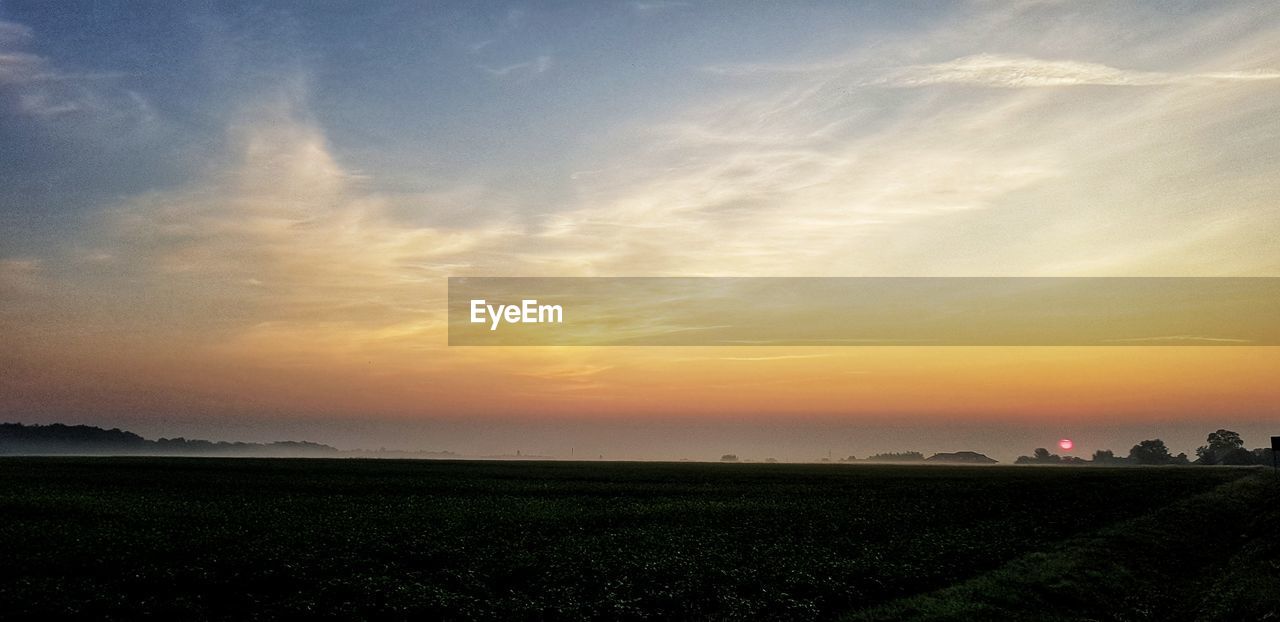 SCENIC VIEW OF SUNSET OVER LAND