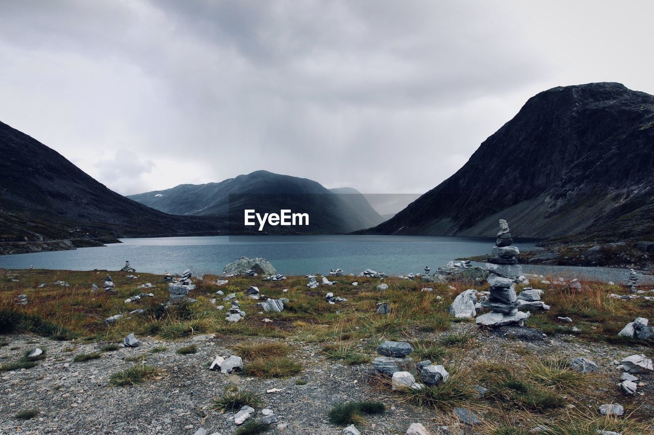 Scenic view of lake and mountains against sky