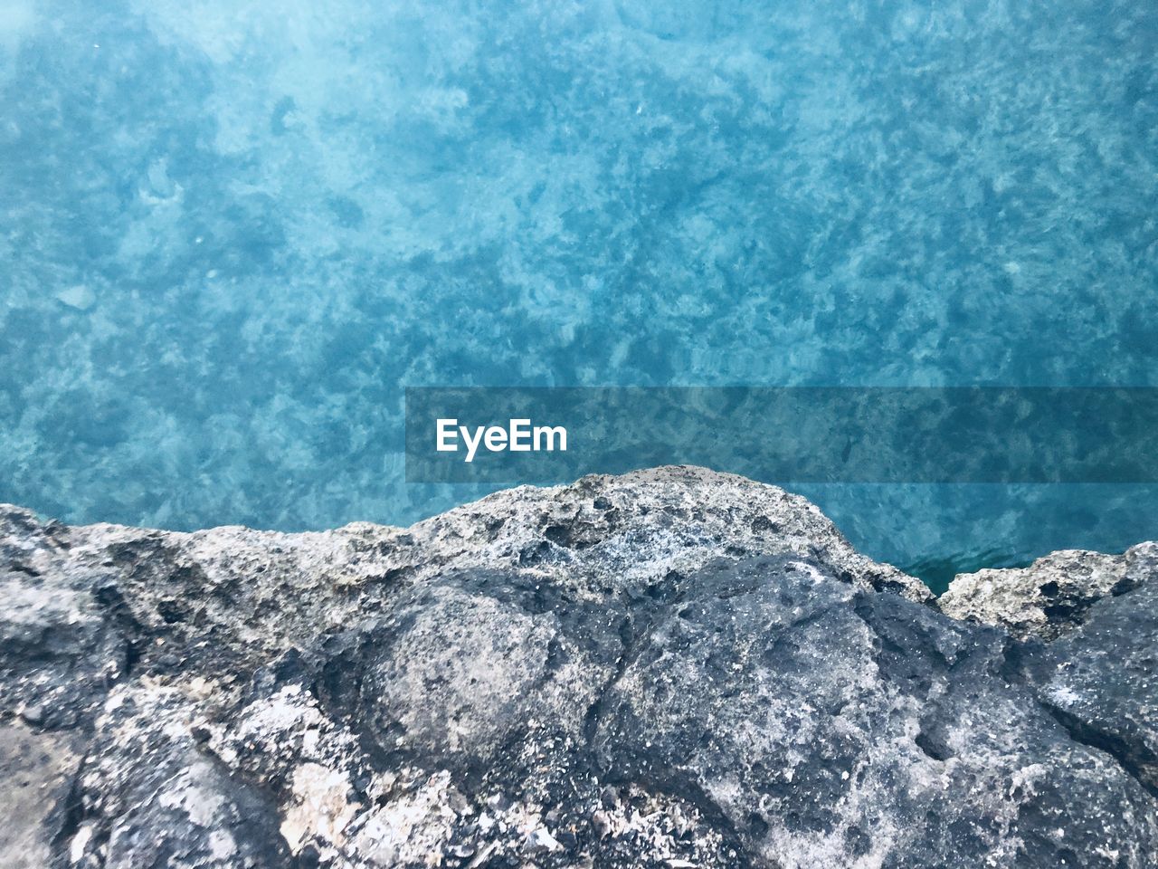 High angle view of rocks by swimming polignano 