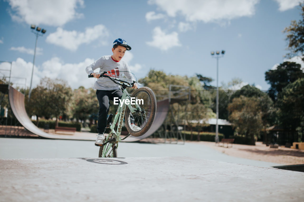 MAN RIDING BICYCLE