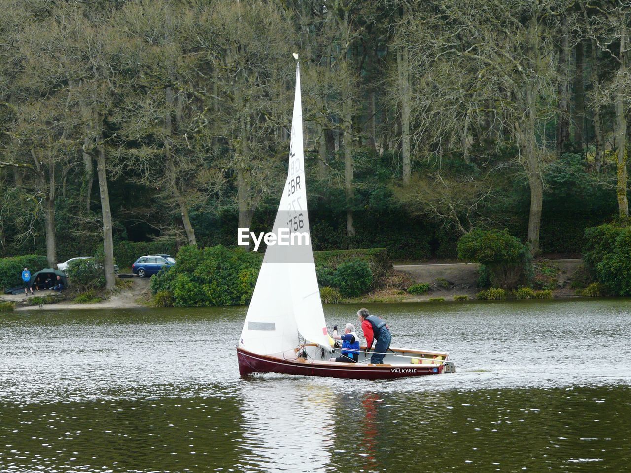 PERSON ROWING BOAT IN RIVER