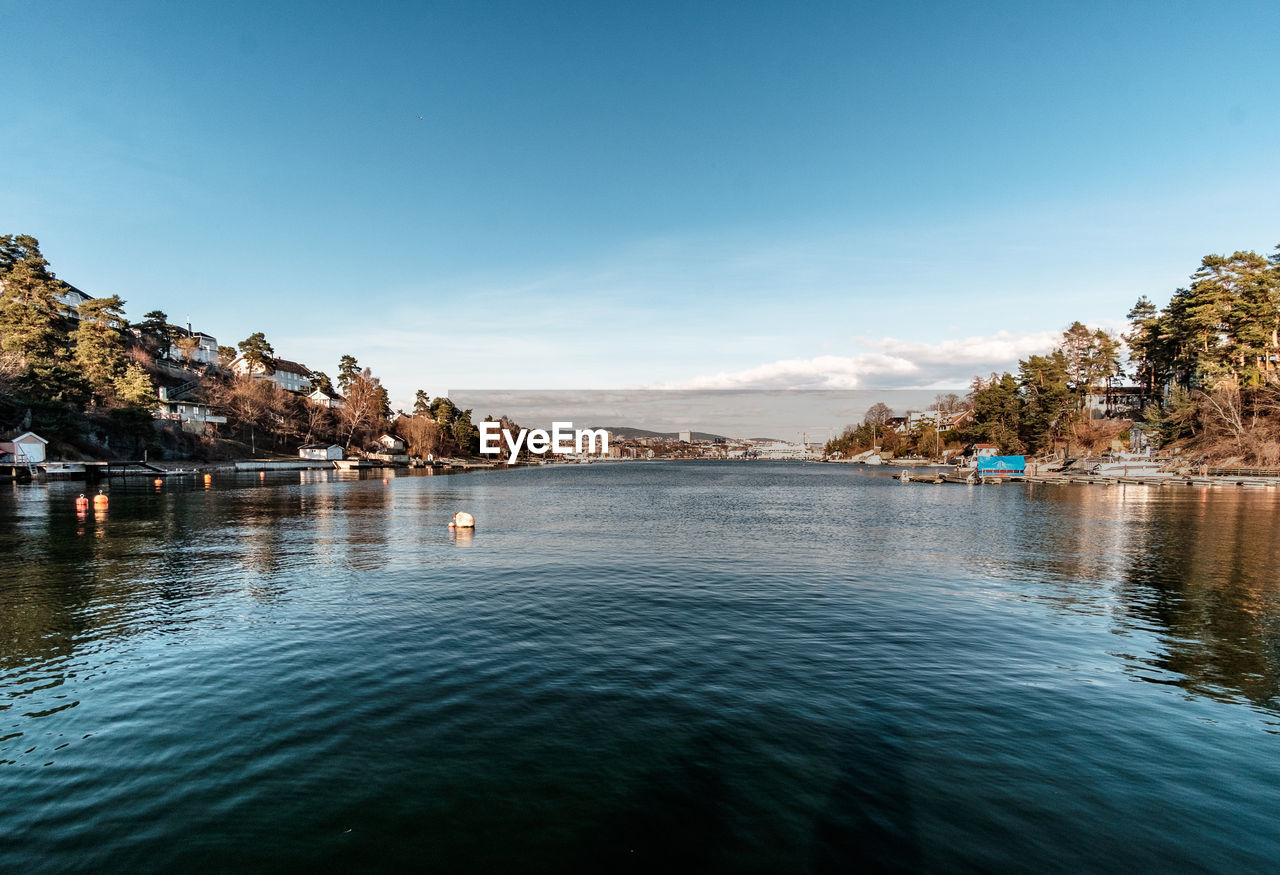 Scenic view of sea against blue sky