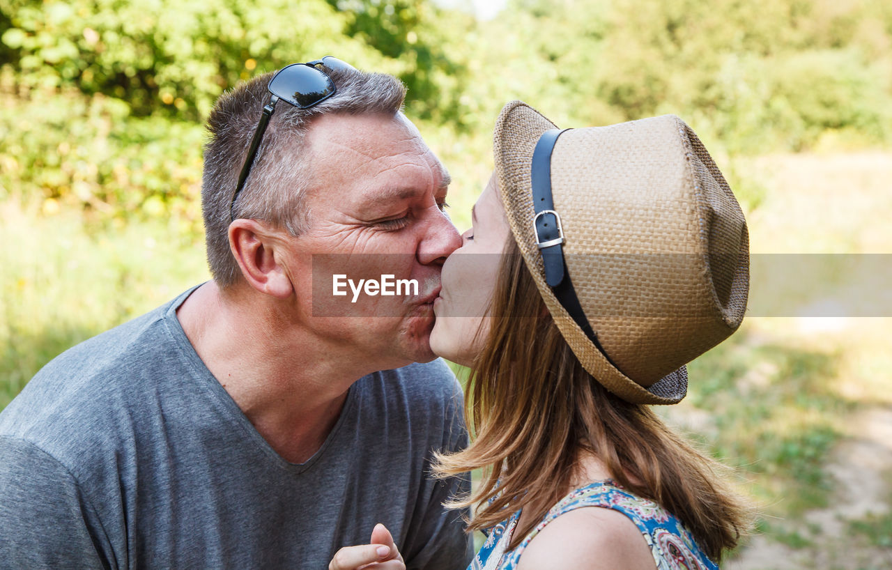 Close-up of couple kissing outdoors