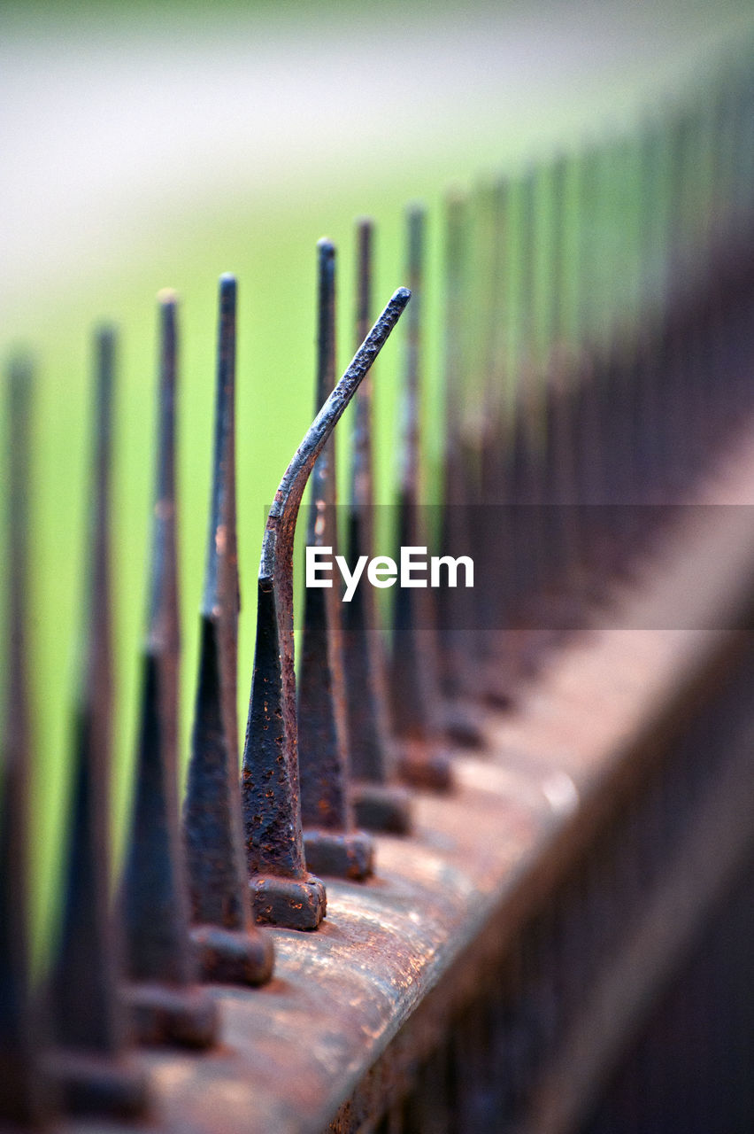 Close-up of rusty metallic fence