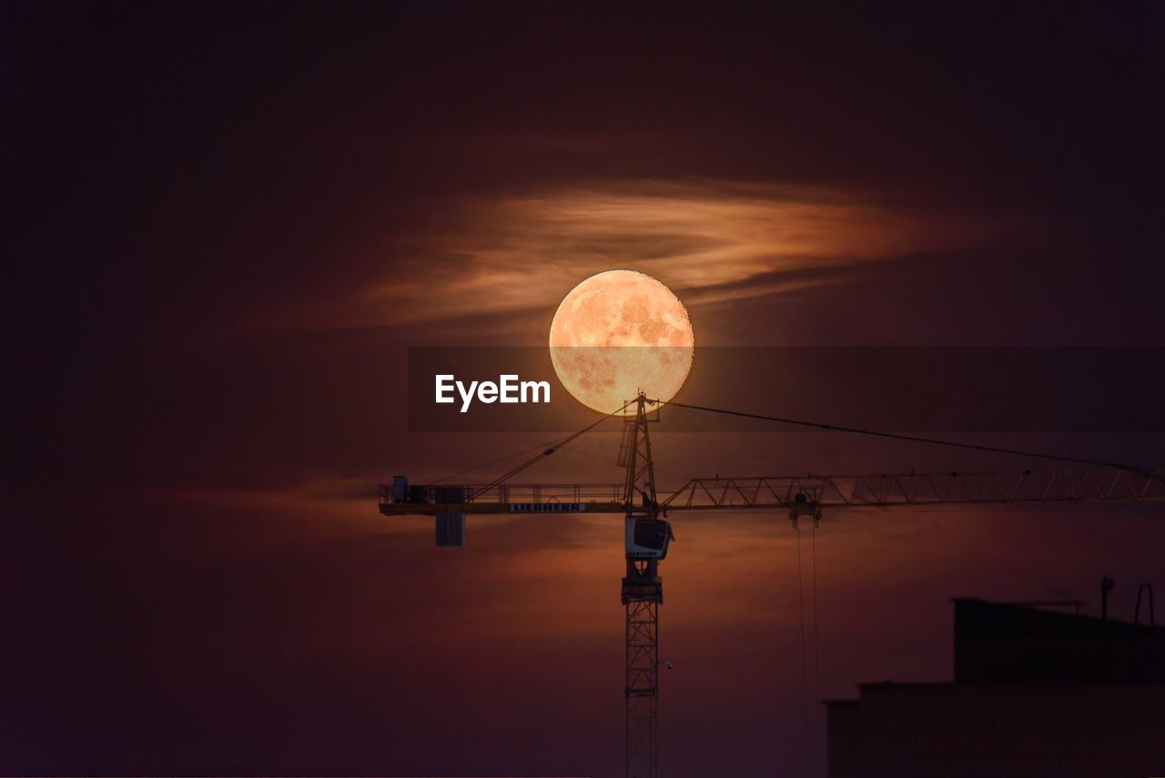 sky, moon, light, astronomical object, night, technology, sunset, nature, no people, darkness, full moon, lighting, architecture, street light, silhouette, space, cloud, astronomy, evening, moonlight, low angle view, outdoors, satellite, beauty in nature, communication, built structure, copy space, dawn, sphere, electricity, illuminated, orange color