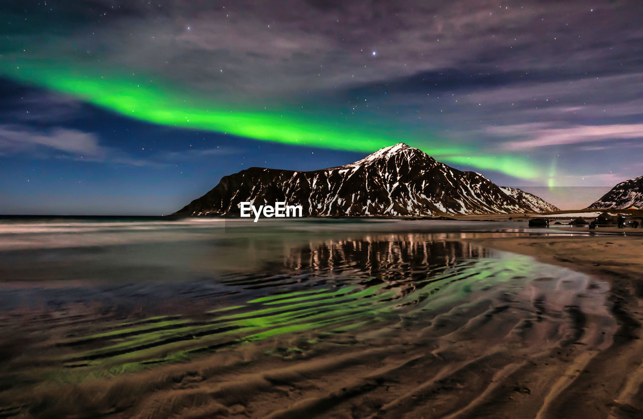 sky, scenics - nature, night, water, environment, landscape, beauty in nature, land, star, nature, travel destinations, aurora, sea, space, mountain, astronomy, dramatic sky, reflection, beach, travel, tranquility, cold temperature, cloud, snow, tranquil scene, winter, long exposure, tourism, no people, outdoors, science, space and astronomy, awe, natural phenomenon, lagoon, idyllic, light - natural phenomenon, architecture, non-urban scene