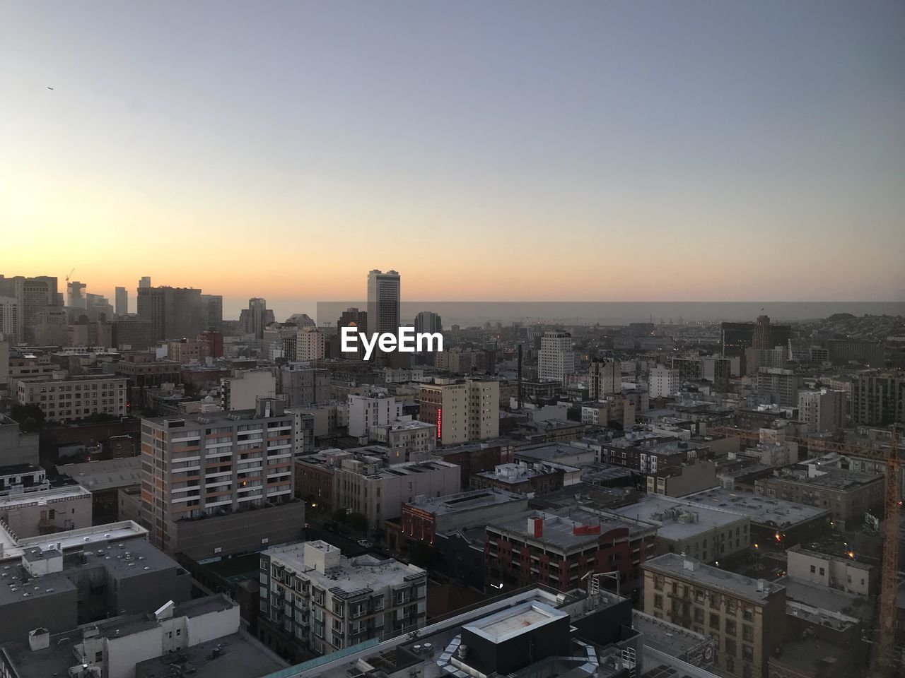 High angle view of buildings against sky during sunset