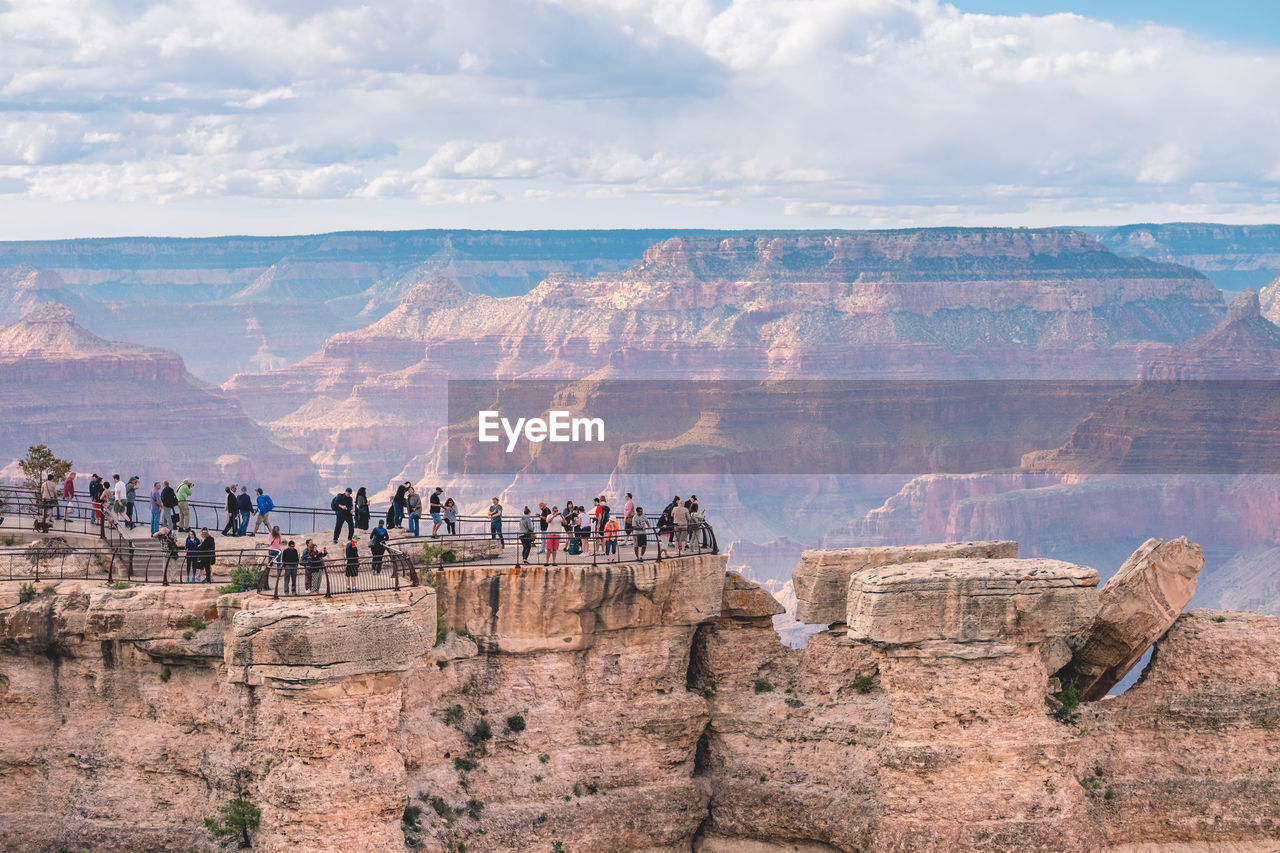 People on cliff at grand canyon