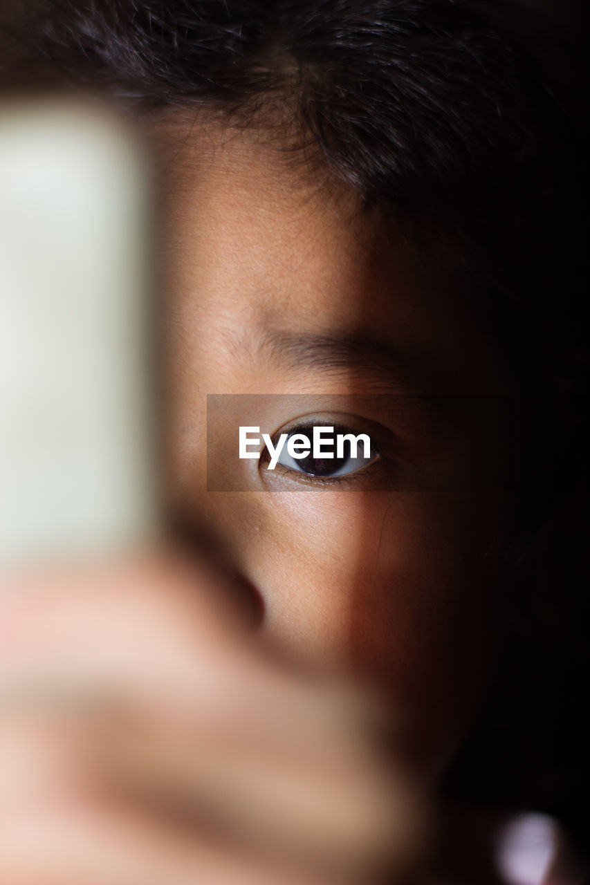 CLOSE-UP PORTRAIT OF BOY WITH EYES