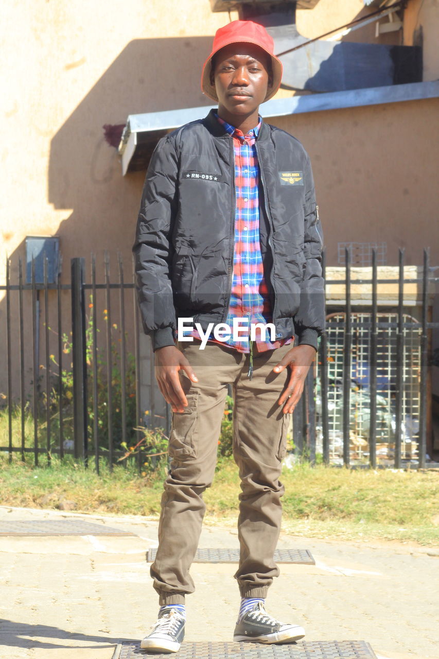 Low section of man standing in photo shooting ground 