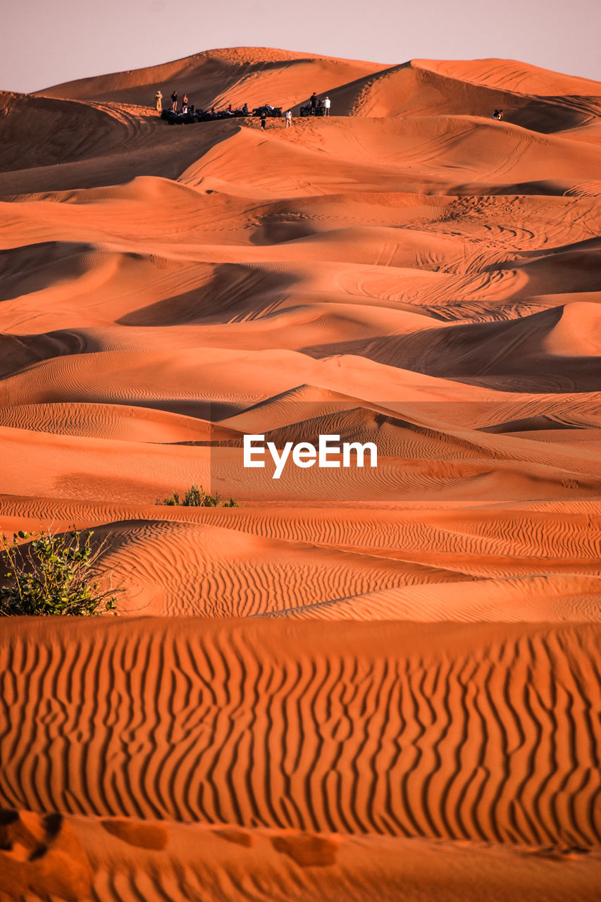 Scenic view of desert against sky during sunset