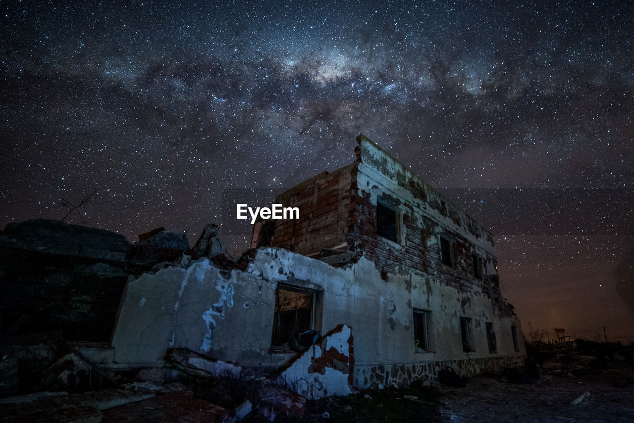 Old building against sky at night