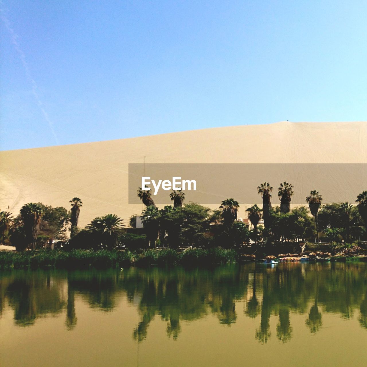 SCENIC VIEW OF LAKE AGAINST BLUE SKY