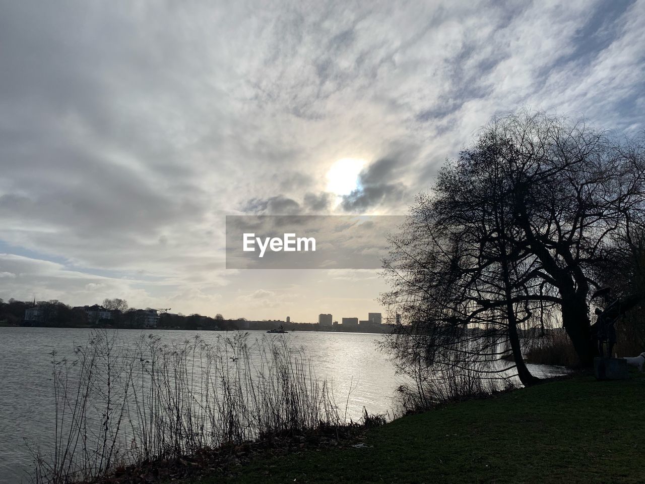 VIEW OF LAKE AGAINST SKY DURING SUNSET