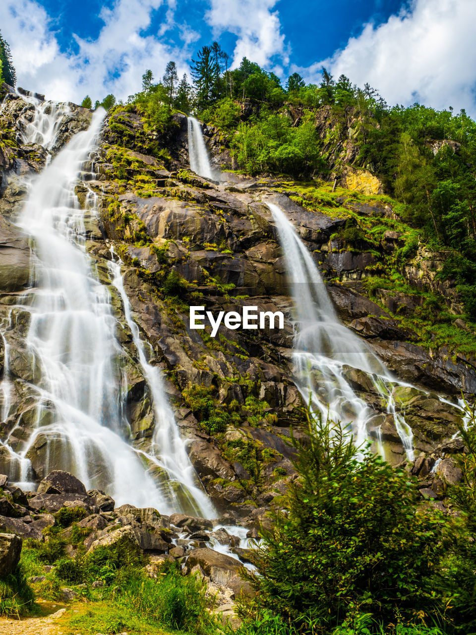 waterfall, scenics - nature, beauty in nature, water, environment, nature, tree, plant, land, cloud, forest, motion, sky, water feature, body of water, travel destinations, landscape, long exposure, rock, travel, tourism, non-urban scene, no people, flowing water, outdoors, holiday, autumn, mountain, trip, flowing, vacation, blurred motion, tropical climate, idyllic, power in nature, speed, green, environmental conservation, summer, river, blue, social issues, rainforest, sports, cliff