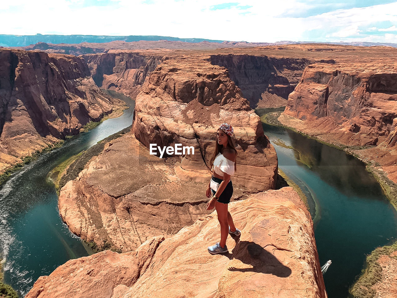 FULL LENGTH OF WOMAN ON ROCK FORMATIONS