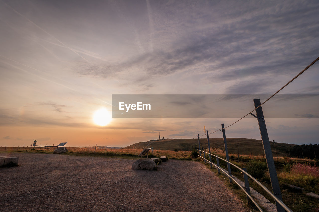 Scenic view of landscape against sky during sunset
