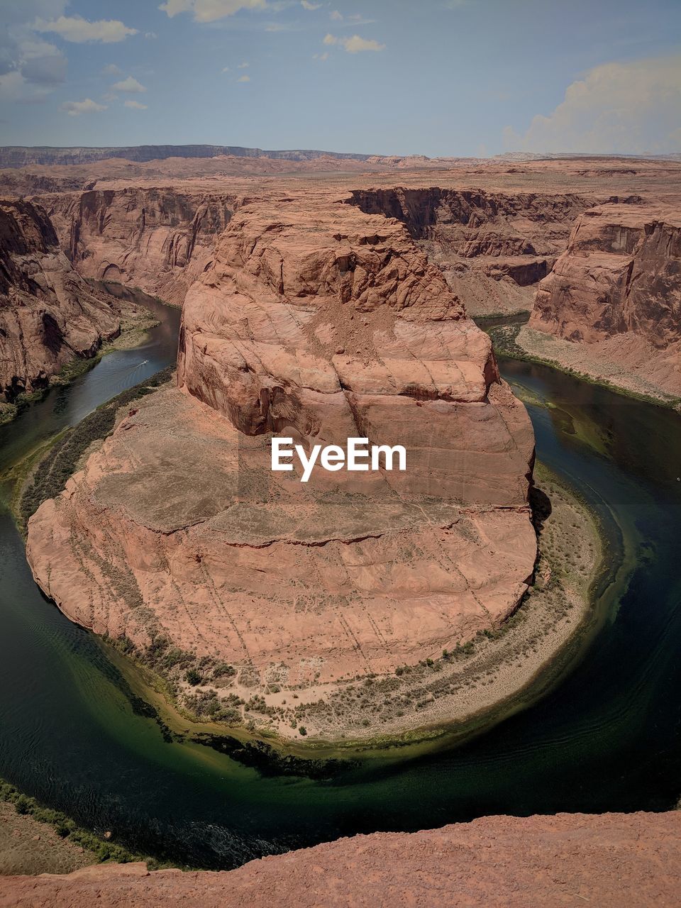 Scenic view of horseshoe bend against sky