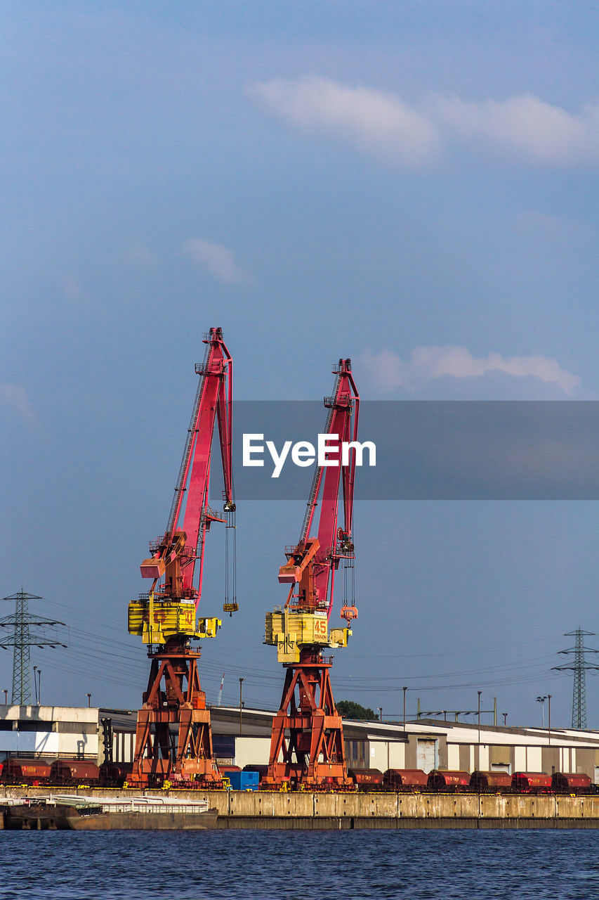 CRANES AT CONSTRUCTION SITE