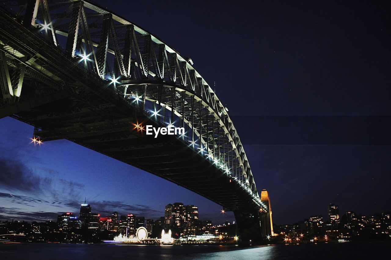 Low angle view of illuminated sydney harbor bridge at night