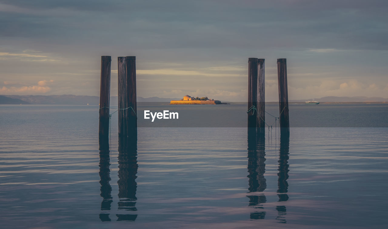 Scenic view of sea against sky at sunset