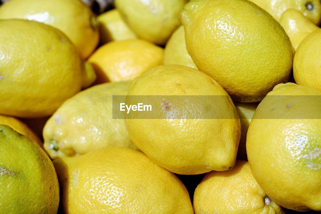 FULL FRAME SHOT OF YELLOW FRUITS