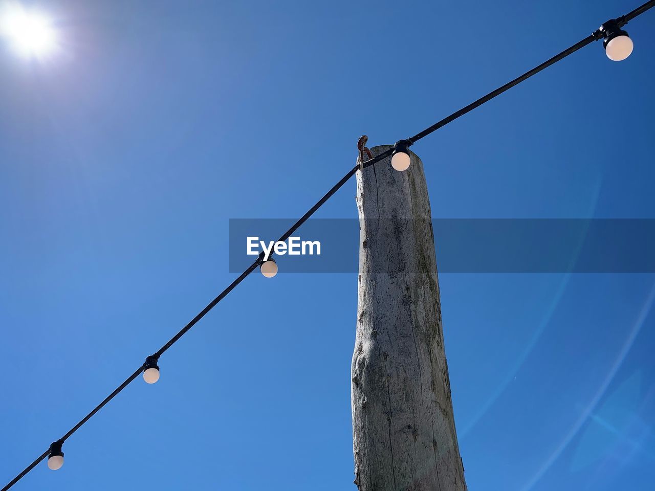 LOW ANGLE VIEW OF STREET LIGHT AGAINST SKY