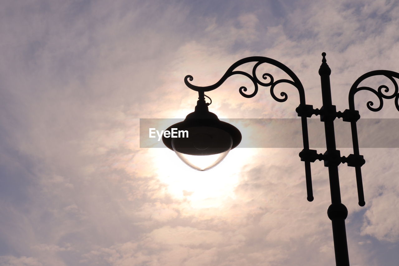 Low angle view of street light against sky