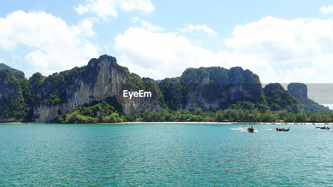 SCENIC VIEW OF SEA AND ROCK FORMATION AGAINST SKY