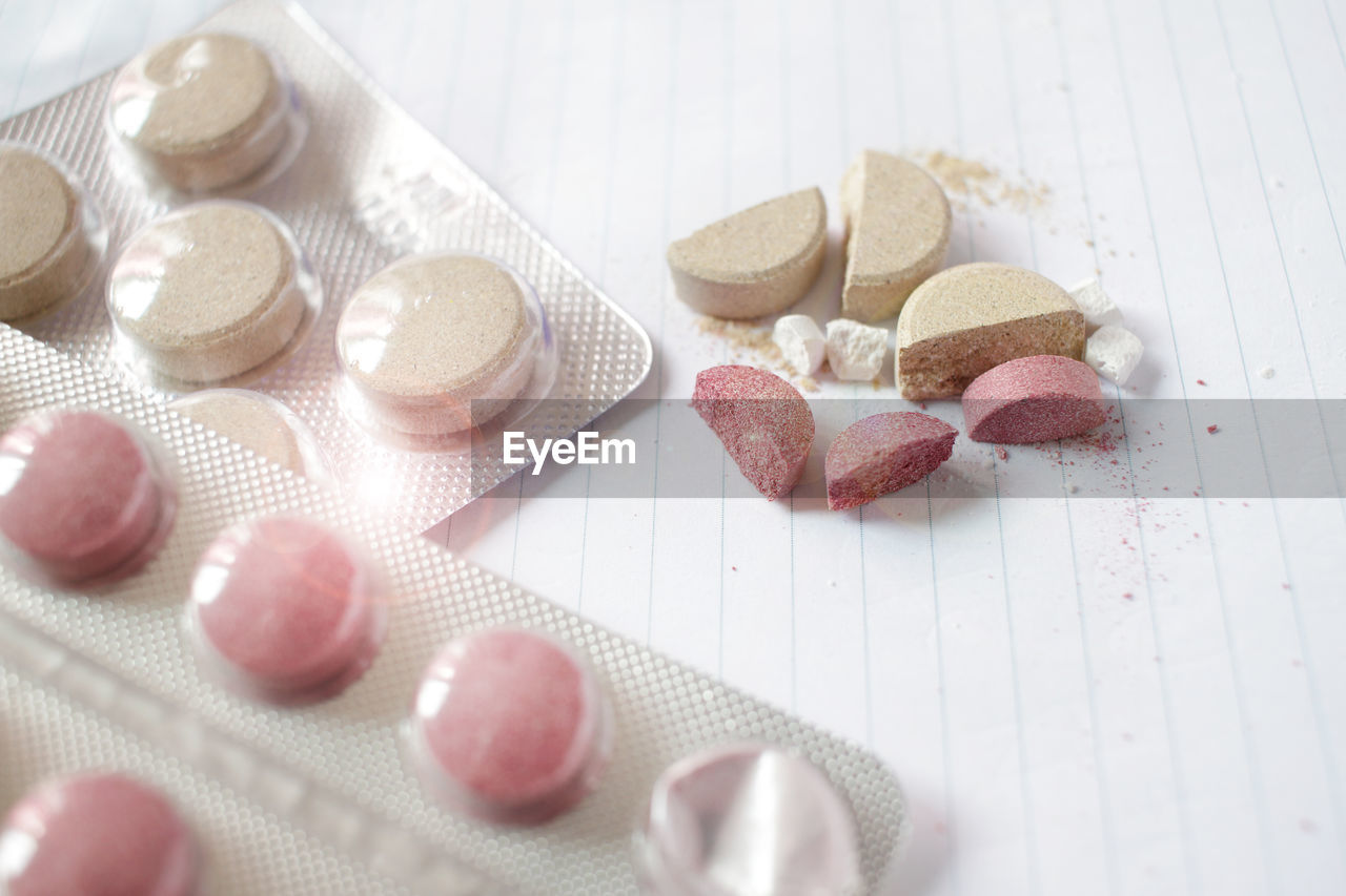 High angle view of pills on paper