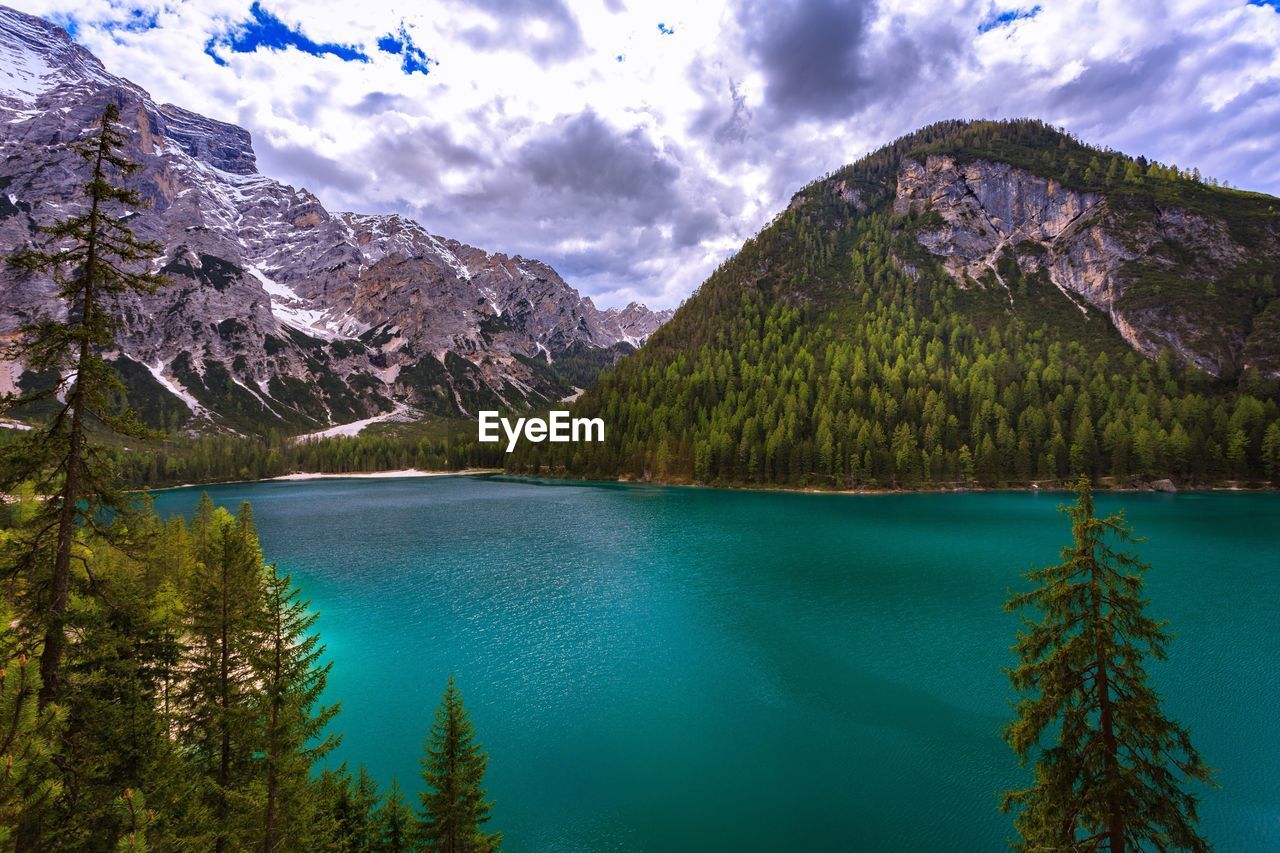 Scenic view of lake and mountains against sky