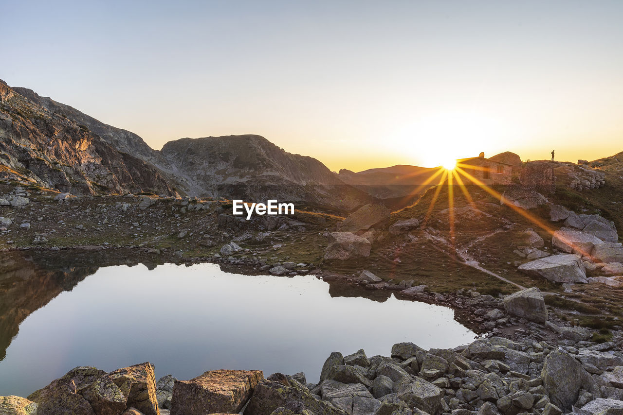 Scenic view of mountains against sky during sunset