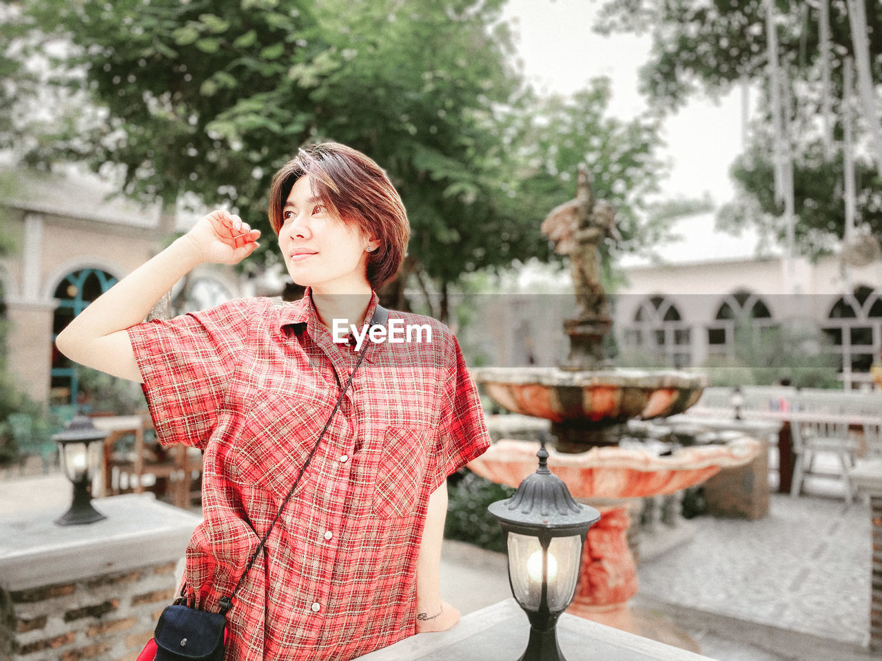  woman holding ice cream standing outdoors