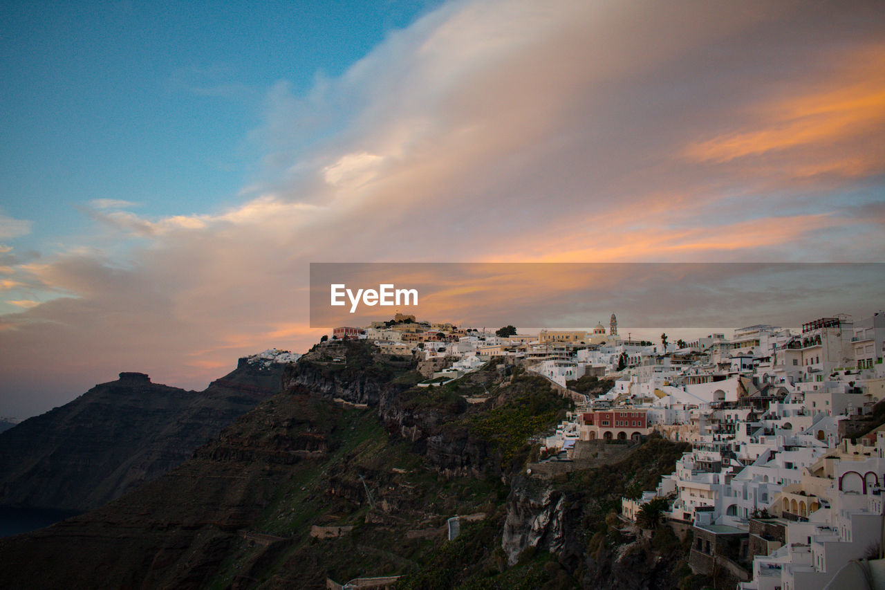 High angle view of townscape against sky at sunset. fira, santorini 