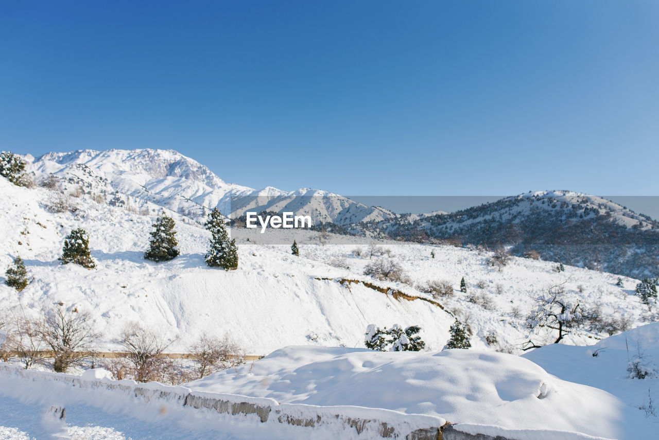 Winter in the mountains of uzbekistan. on the way to beldersay resort. tian shan mountain range