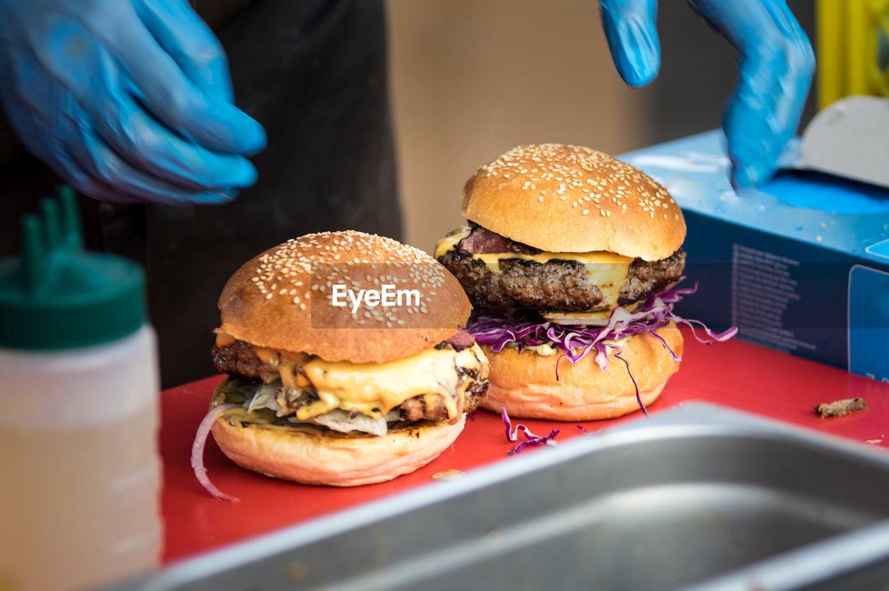 Close-up of burgers on table