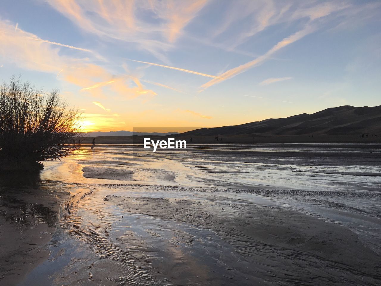Scenic view of landscape against sky during sunset