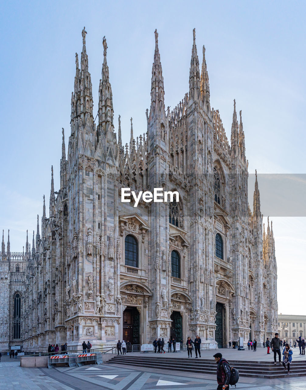 GROUP OF PEOPLE IN FRONT OF CATHEDRAL