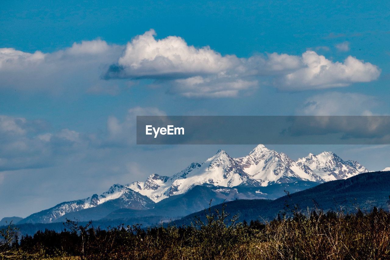 Scenic view of snowcapped mountains against sky