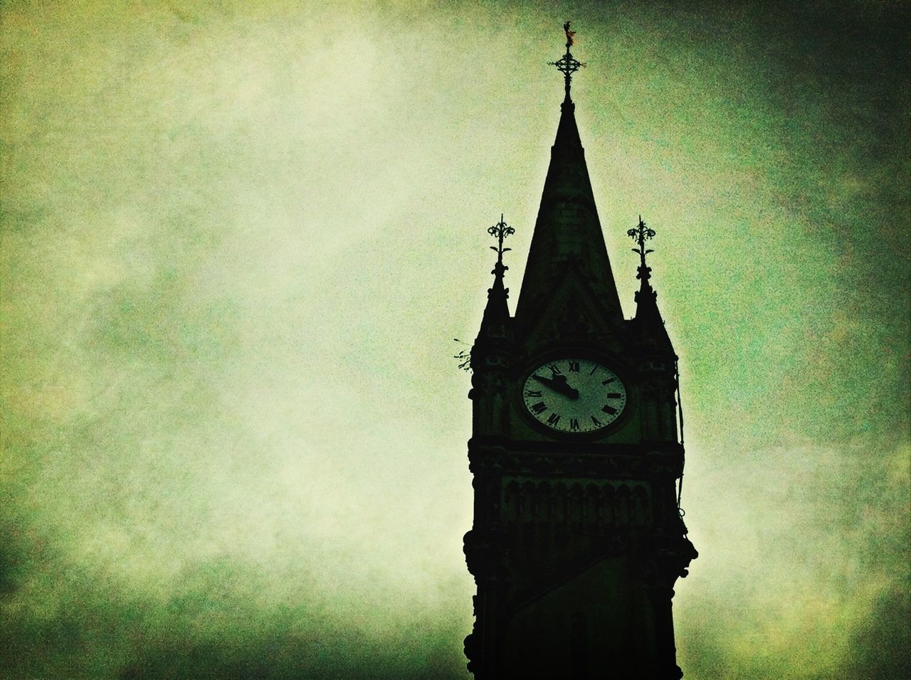 LOW ANGLE VIEW OF CLOCK TOWER