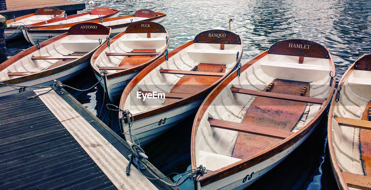 High angle view of wooden boats moored on harbor