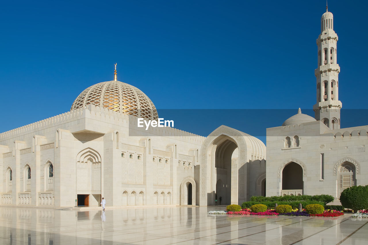 Exterior of mosque against clear blue sky