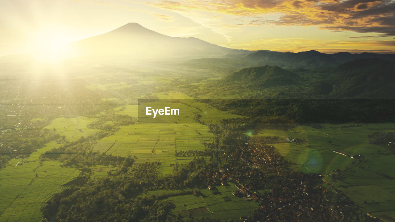 Scenic view of landscape against sky during sunset