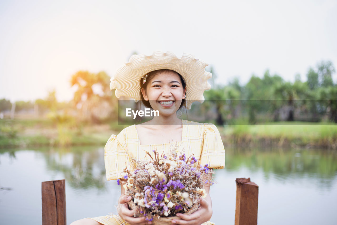 Beauty young woman with flowers and make up close , real spring girl