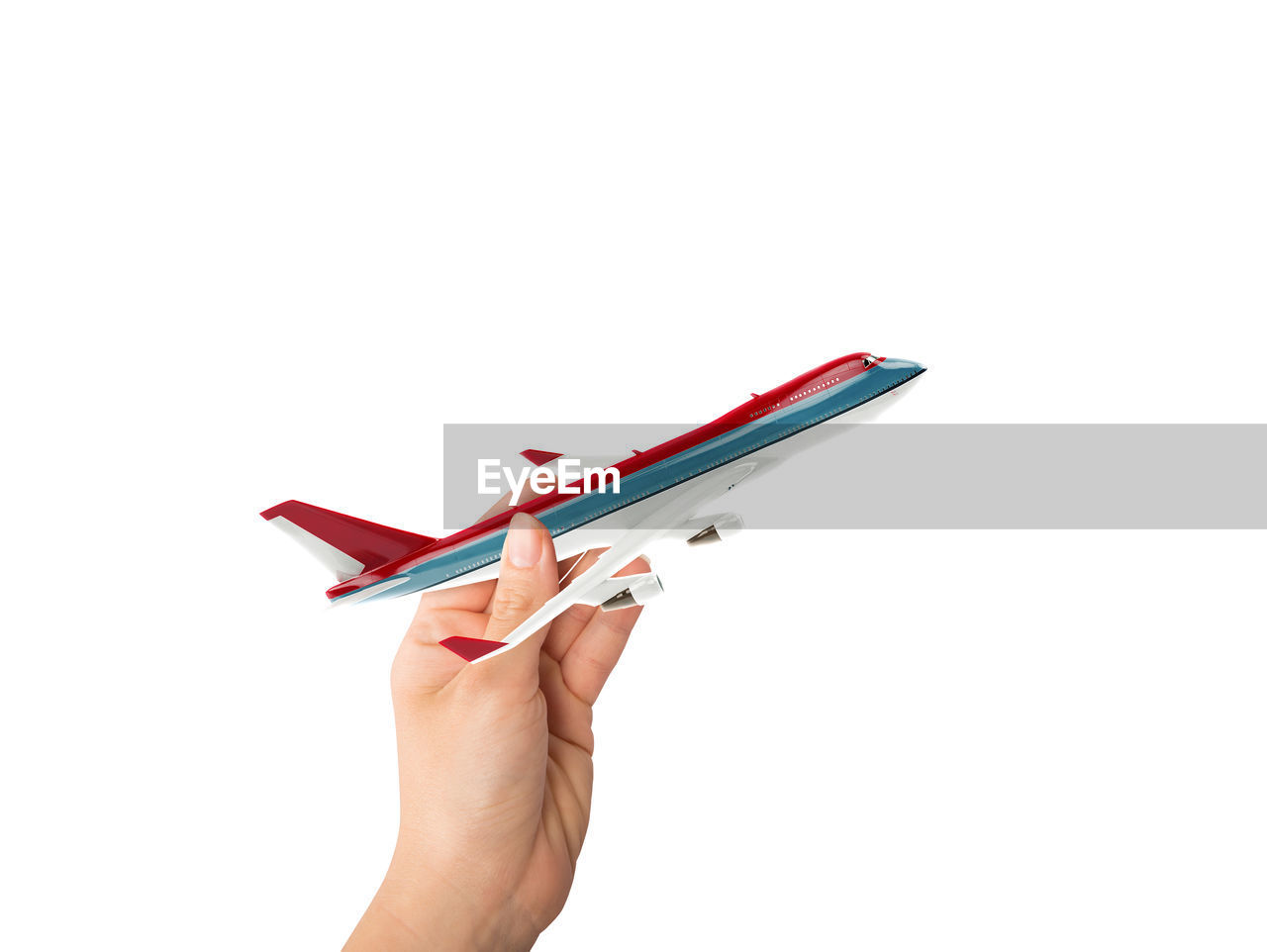 hand, one person, white background, holding, cut out, studio shot, indoors, copy space, paper, adult, women, red, writing, airplane, pen, office supplies